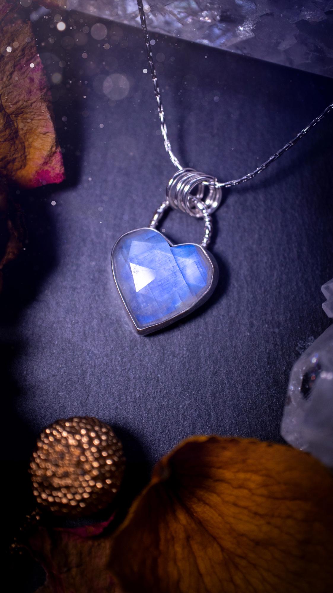 Beautifully handmade, rose cut, rainbow moonstone pendant necklace. This beautiful rainbow moonstone crystal is heart shaped and has a gorgeous flash and sparkle. Made from sterling silver and super dainty. Ideal gift for crystal lovers. Hippy gifts