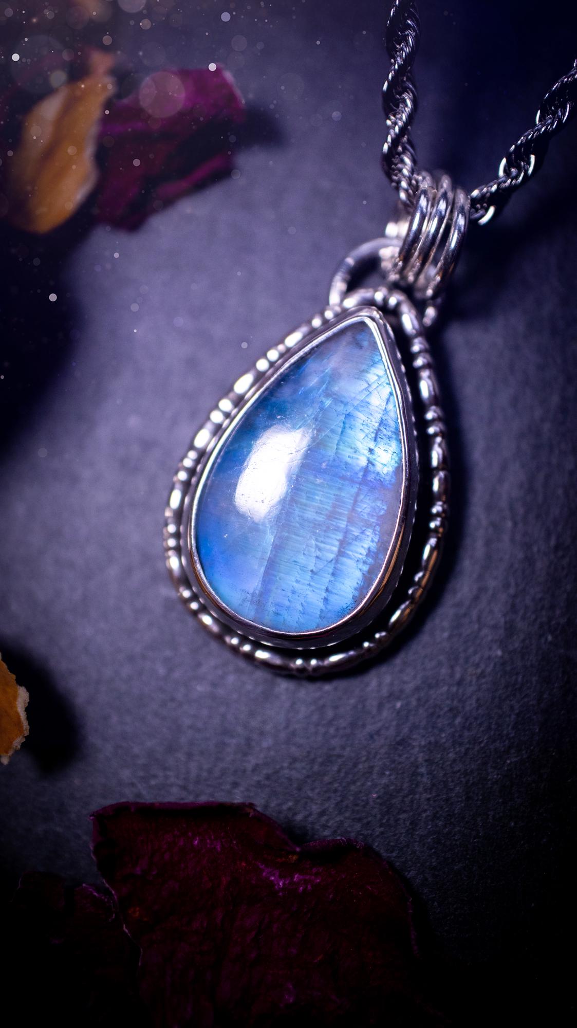 Stunning and handcrafted, Rainbow moonstone. This one of a kind pendant has been made using recycled sterling silver and fine silver, accompanied by a fancy wire around the bezel to make it unique. Ideal gift for her and crystal lovers, witchy gothic