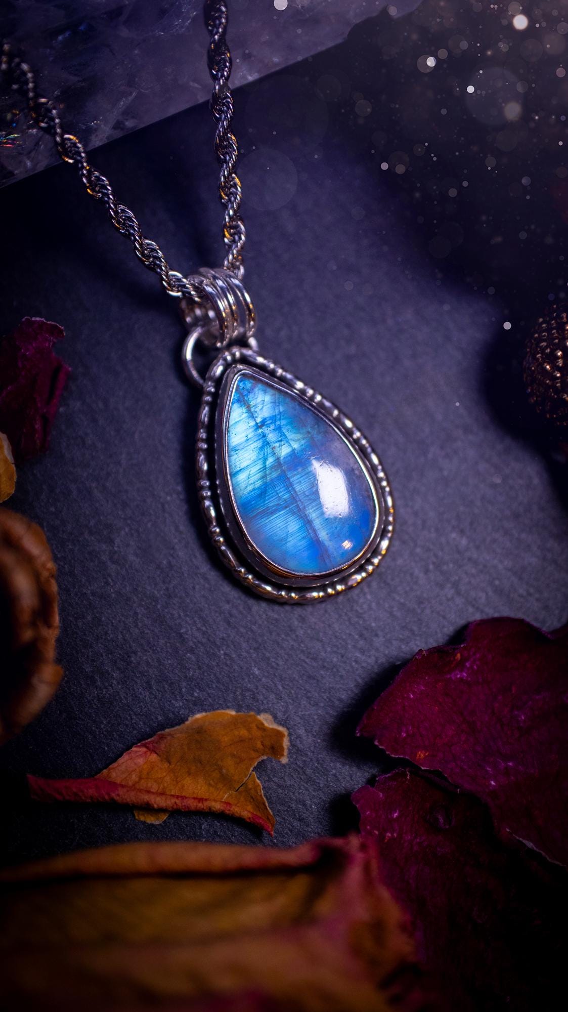 Stunning and handcrafted, Rainbow moonstone. This one of a kind pendant has been made using recycled sterling silver and fine silver, accompanied by a fancy wire around the bezel to make it unique. Ideal gift for her and crystal lovers, witchy gothic