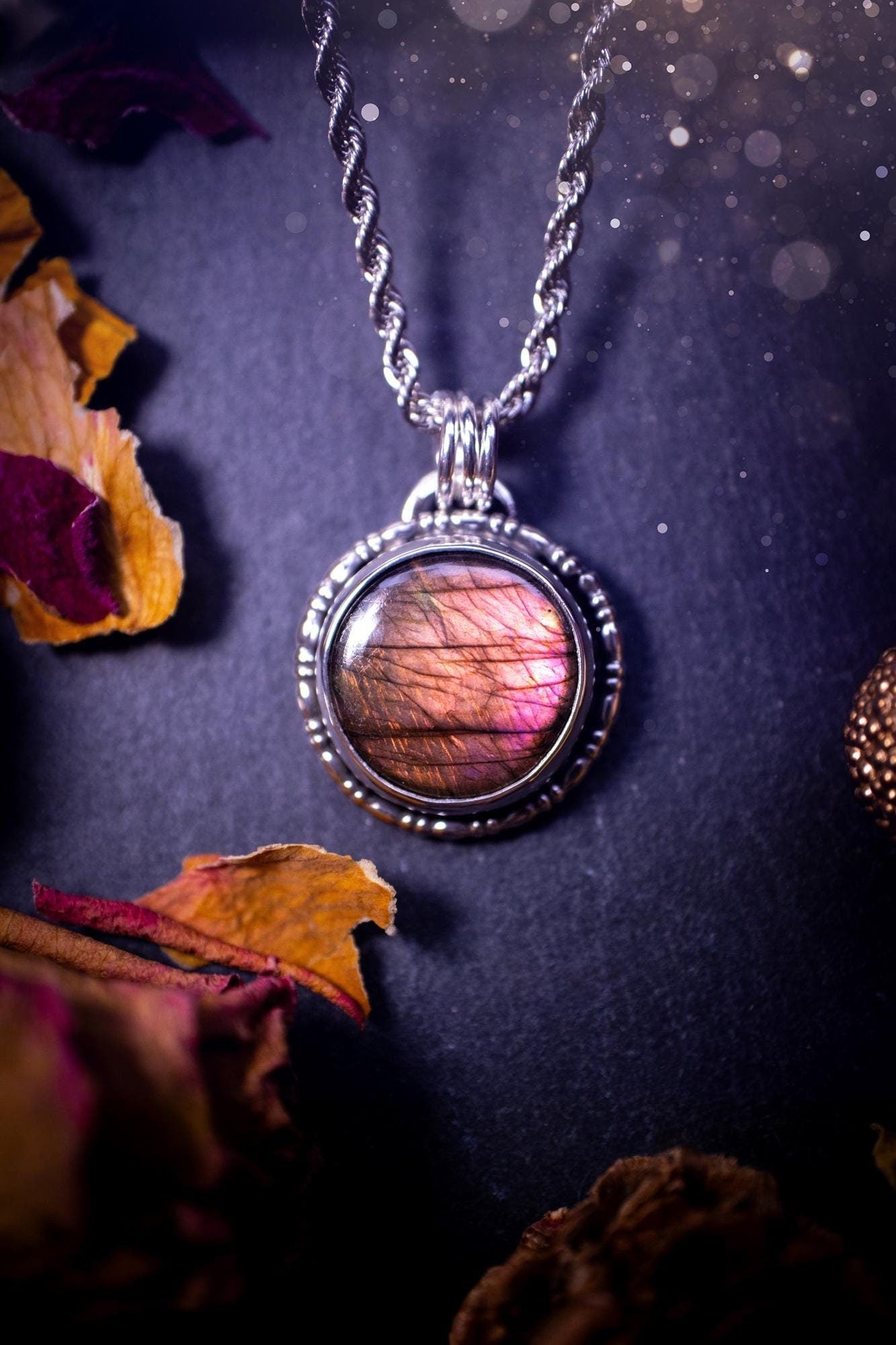 Beautifully handmade, dainty purple, orange, and pink sunset Labradorite spectrolite pendant necklace. This circular labradorite is full of stunning colour and patterns which has been made into a pendant using recycled sterling silver. Crystal gift