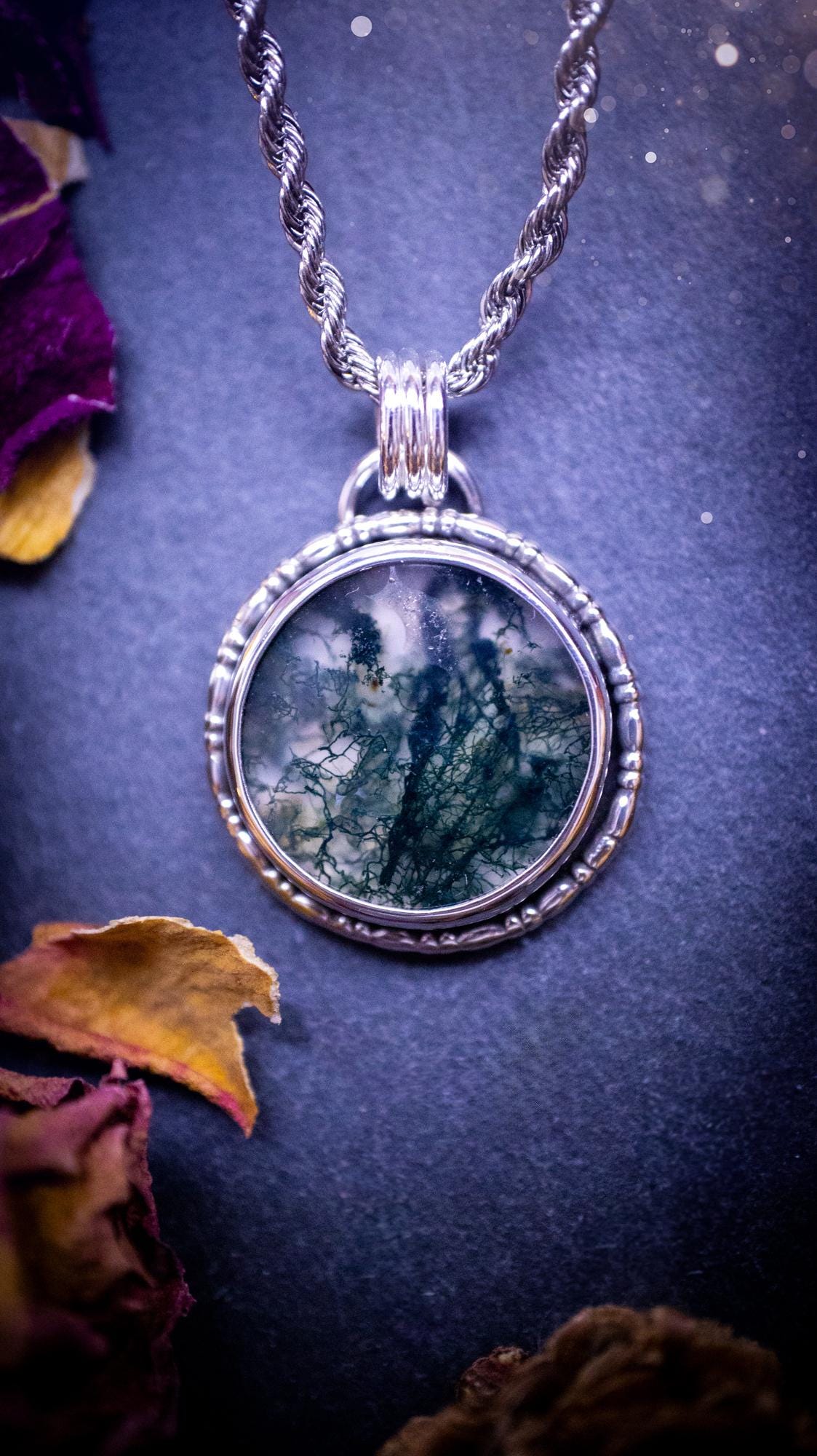 Beautifully handmade, dainty, moss agate crystal pendant necklace. This circular moss agate is full of stunning colour and patterns which has been made into a pendant using recycled sterling silver. Crystal gifts, gothic and hippy jewellery.