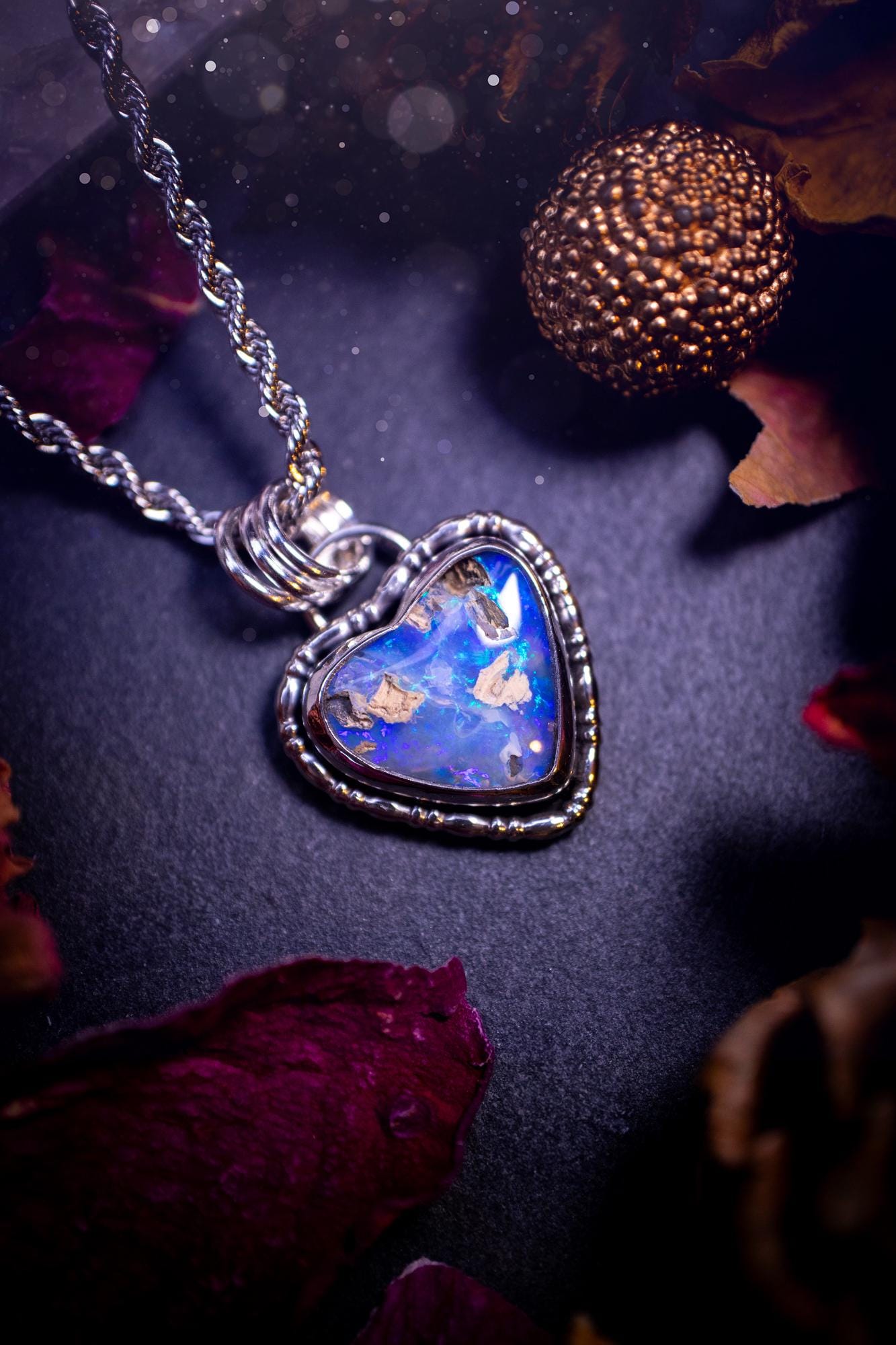 Handmade and stunning, Australian pipe opal, sterling silver, heart pendant necklace. Featuring a super flashy opal with hues of blue, green and purple. Made from recycled sterling silver with fancy gallery wire. Ideal gift for opal lovers. Bohemian