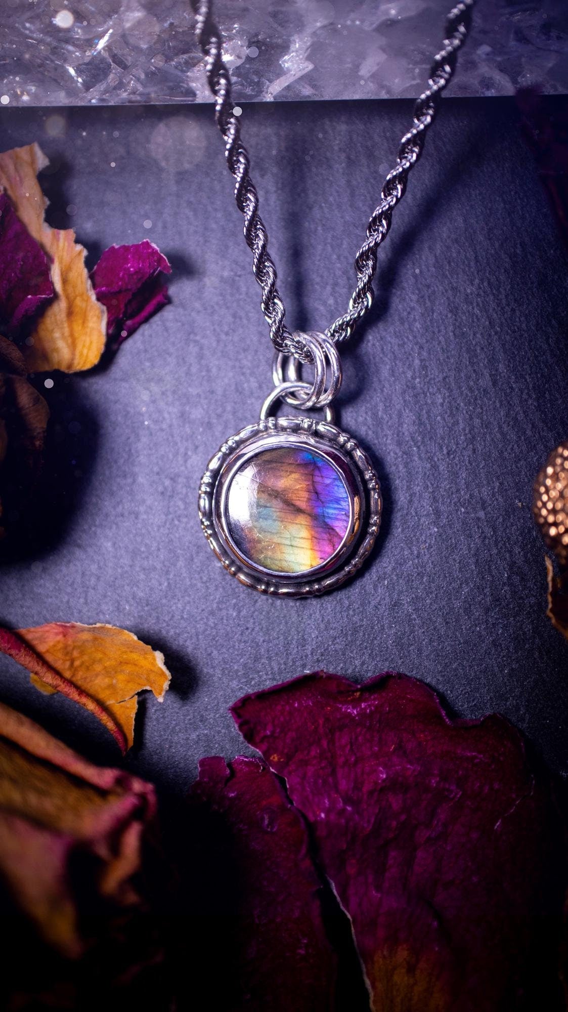 Beautifully handcrafted, dainty purple, orange, green and pink Labradorite spectrolite pendant necklace. This circular labradorite is full of stunning colour and patterns which has been made into a pendant using recycled sterling silver. Crystal gift