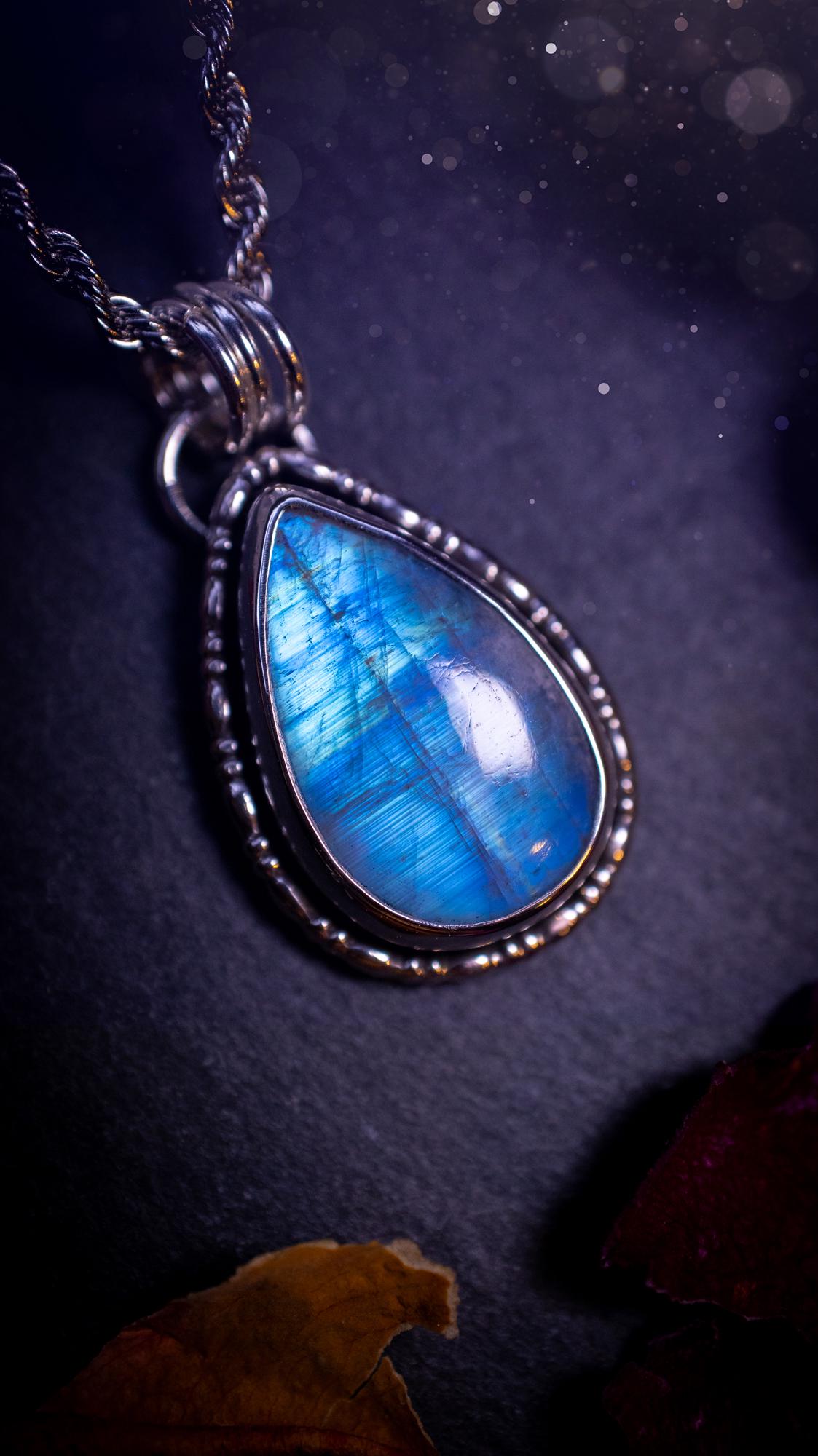 Stunning and handcrafted, Rainbow moonstone. This one of a kind pendant has been made using recycled sterling silver and fine silver, accompanied by a fancy wire around the bezel to make it unique. Ideal gift for her and crystal lovers, witchy gothic