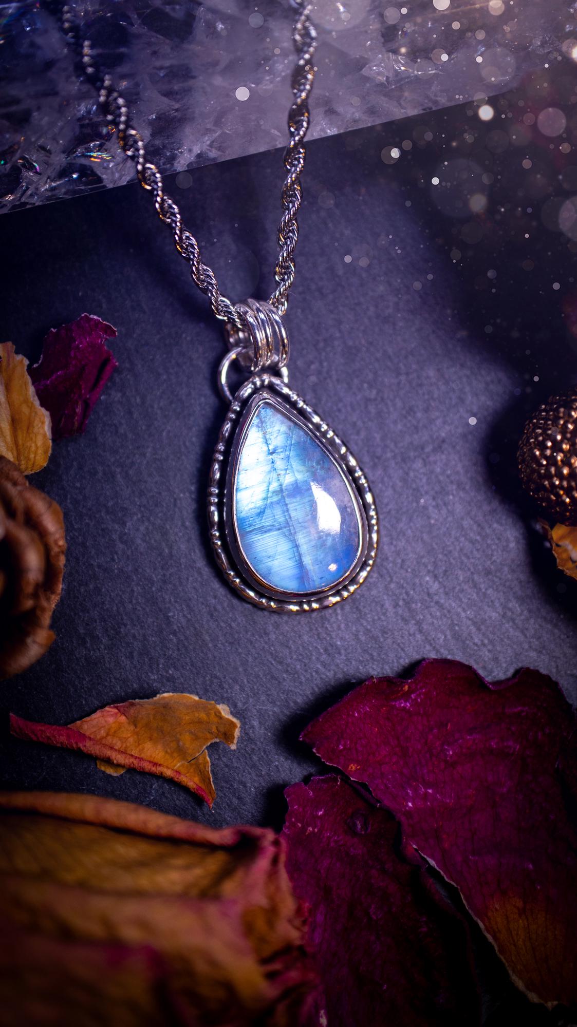 Stunning and handcrafted, Rainbow moonstone. This one of a kind pendant has been made using recycled sterling silver and fine silver, accompanied by a fancy wire around the bezel to make it unique. Ideal gift for her and crystal lovers, witchy gothic