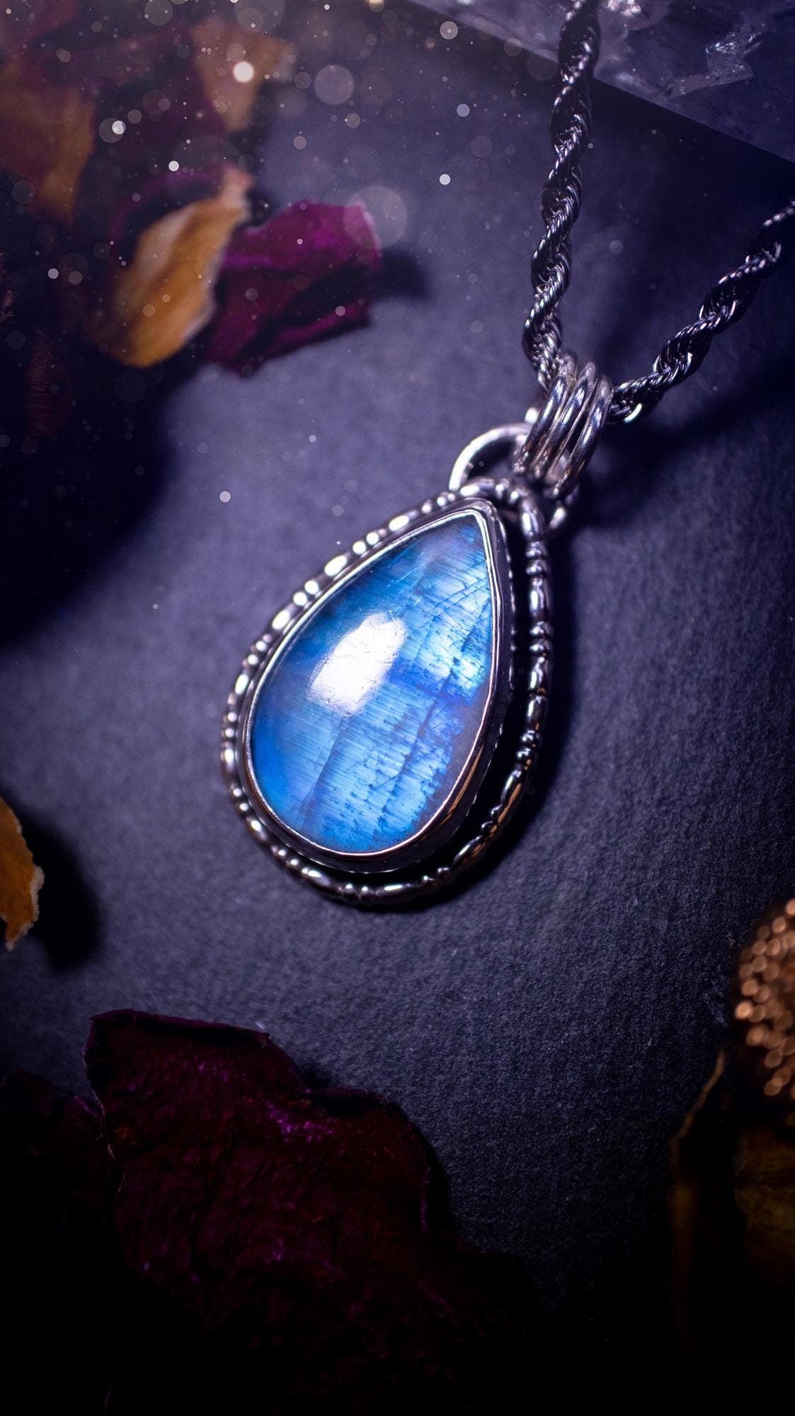 Stunning and handcrafted, Rainbow moonstone. This one of a kind pendant has been made using recycled sterling silver and fine silver, accompanied by a fancy wire around the bezel to make it unique. Ideal gift for her and crystal lovers, witchy gothic