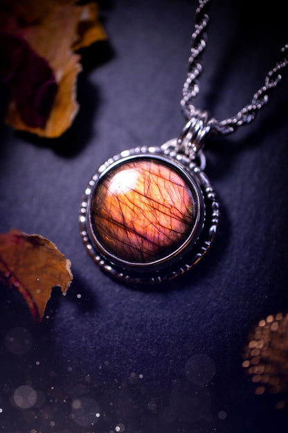 Beautifully handmade, dainty purple, orange, and pink sunset Labradorite spectrolite pendant necklace. This circular labradorite is full of stunning colour and patterns which has been made into a pendant using recycled sterling silver. Crystal gift