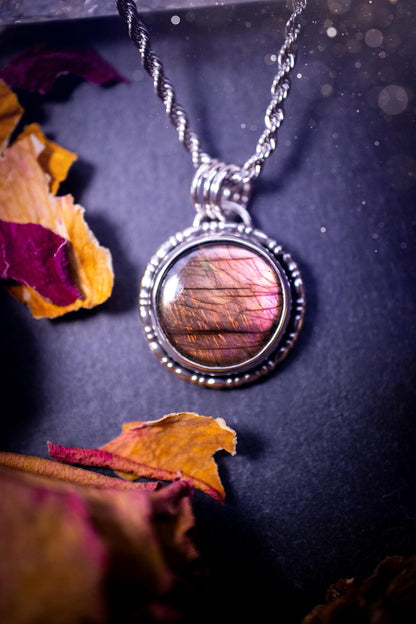 Beautifully handmade, dainty purple, orange, and pink sunset Labradorite spectrolite pendant necklace. This circular labradorite is full of stunning colour and patterns which has been made into a pendant using recycled sterling silver. Crystal gift