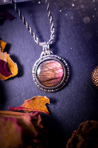 Beautifully handmade, dainty purple, orange, and pink sunset Labradorite spectrolite pendant necklace. This circular labradorite is full of stunning colour and patterns which has been made into a pendant using recycled sterling silver. Crystal gift