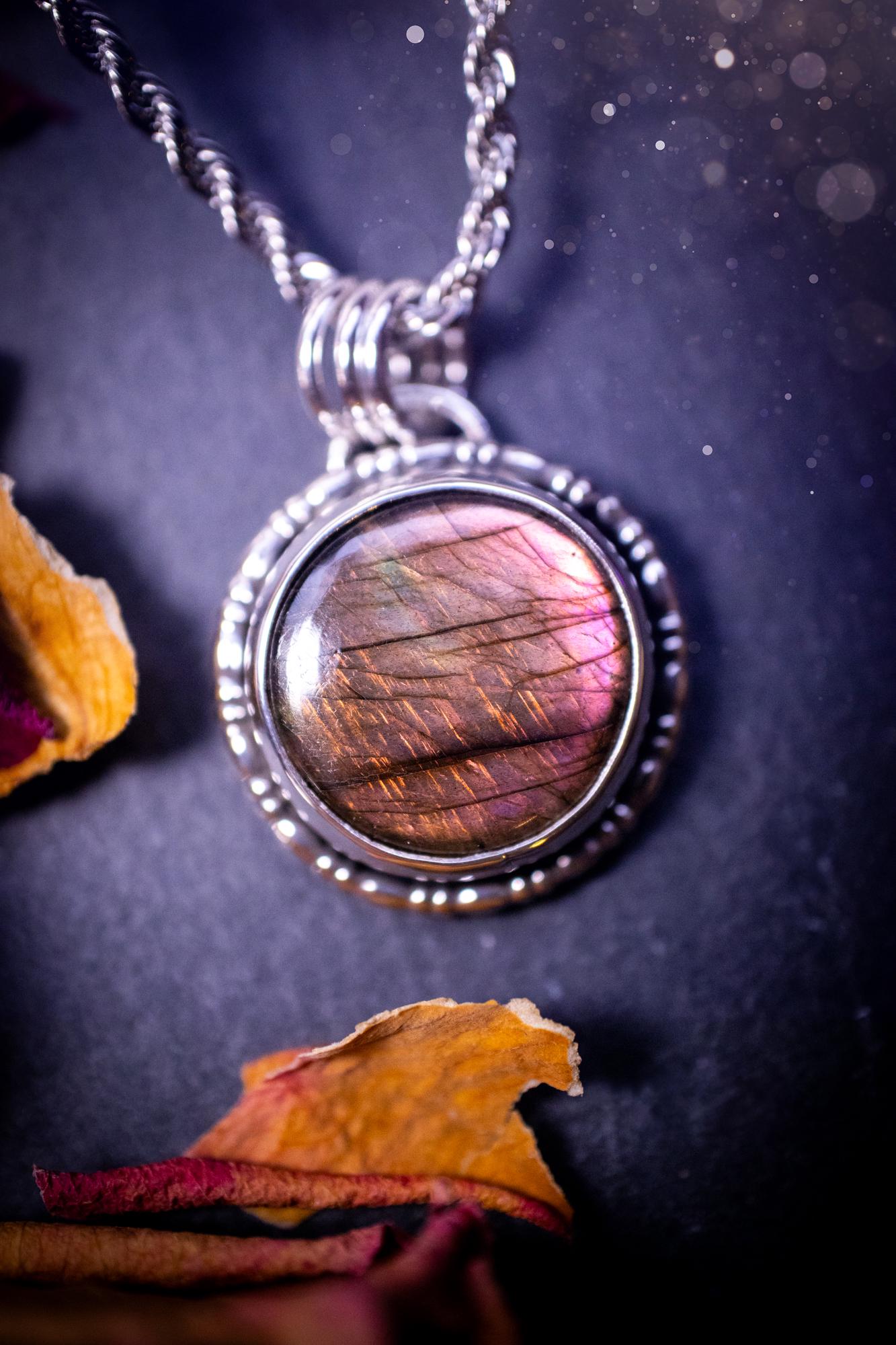 Beautifully handmade, dainty purple, orange, and pink sunset Labradorite spectrolite pendant necklace. This circular labradorite is full of stunning colour and patterns which has been made into a pendant using recycled sterling silver. Crystal gift