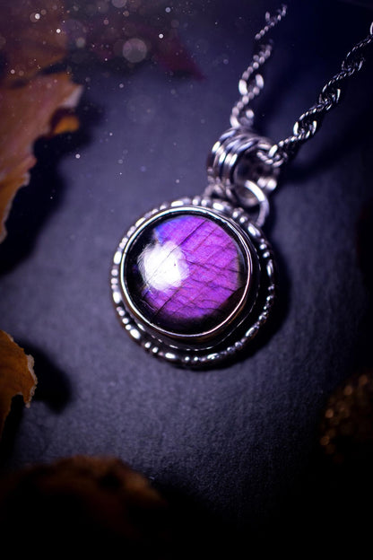 Beautifully handcrafted, dainty, deep purple  Labradorite spectrolite pendant necklace. This circular labradorite is full of stunning colour and patterns which has been made into a pendant using recycled sterling silver. Crystal gifts, gothic, hippy