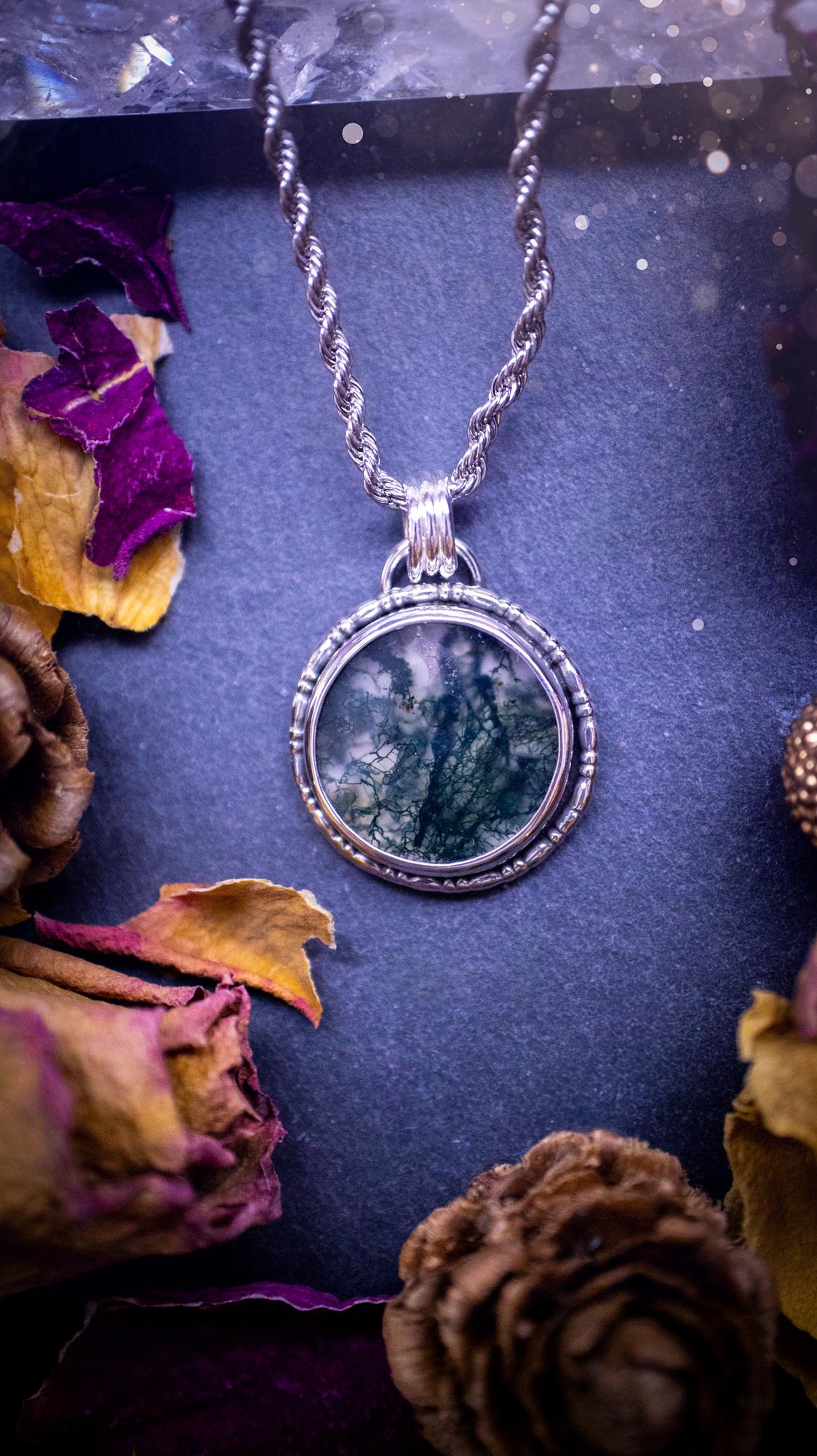 Beautifully handmade, dainty, moss agate crystal pendant necklace. This circular moss agate is full of stunning colour and patterns which has been made into a pendant using recycled sterling silver. Crystal gifts, gothic and hippy jewellery.