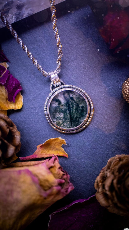 Beautifully handmade, dainty, moss agate crystal pendant necklace. This circular moss agate is full of stunning colour and patterns which has been made into a pendant using recycled sterling silver. Crystal gifts, gothic and hippy jewellery.