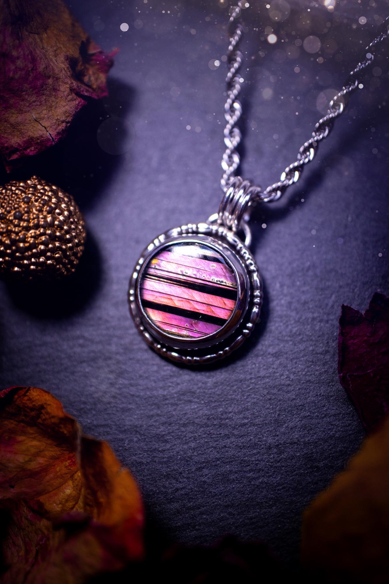 Beautifully handmade, dainty purple, orange, and pink sunset Labradorite spectrolite pendant necklace. This circular labradorite is full of stunning colour and patterns which has been made into a pendant using recycled sterling silver. Crystal gift