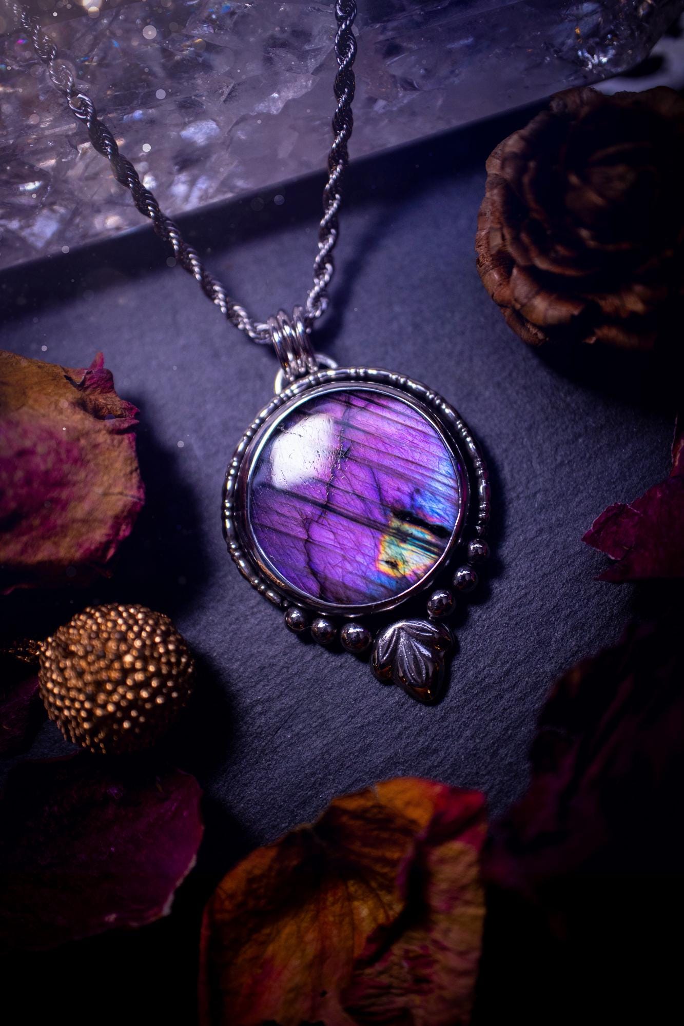 Beautiful and handmade, natural stripey blue and purple labradorite, crystal pendant necklace. This necklace has been made from fine and sterling silver and features silver leaf and ball components. The ideal gift for crystal lovers. Hippy, gothic.