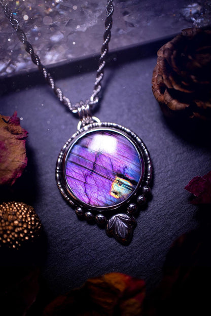 Beautiful and handmade, natural stripey blue and purple labradorite, crystal pendant necklace. This necklace has been made from fine and sterling silver and features silver leaf and ball components. The ideal gift for crystal lovers. Hippy, gothic.