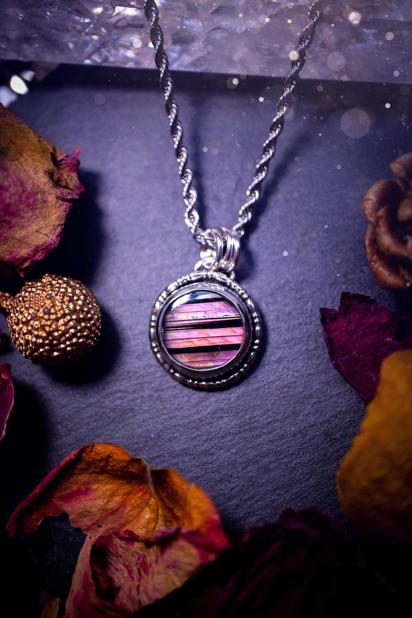 Beautifully handmade, dainty purple, orange, and pink sunset Labradorite spectrolite pendant necklace. This circular labradorite is full of stunning colour and patterns which has been made into a pendant using recycled sterling silver. Crystal gift