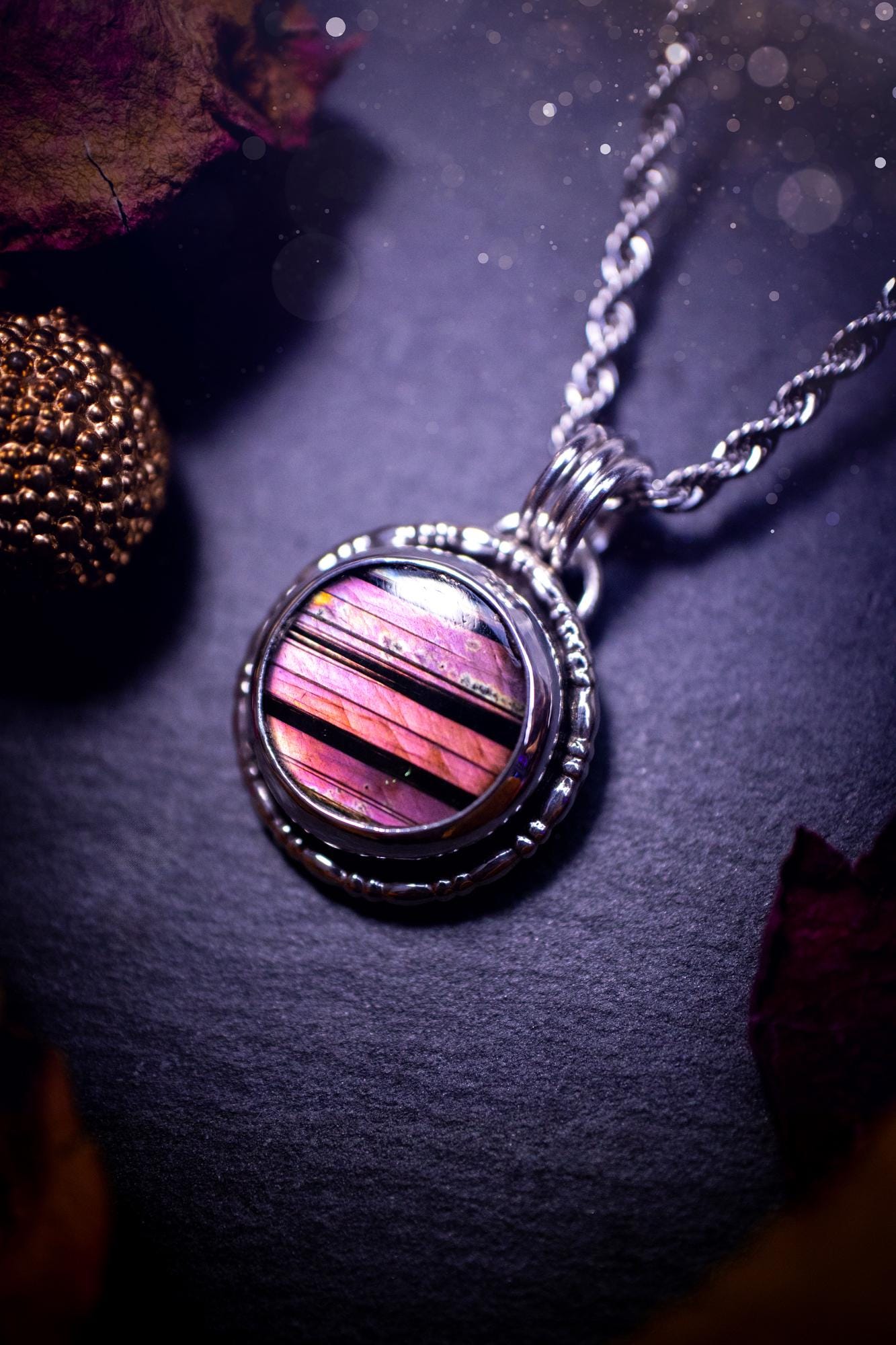 Beautifully handmade, dainty purple, orange, and pink sunset Labradorite spectrolite pendant necklace. This circular labradorite is full of stunning colour and patterns which has been made into a pendant using recycled sterling silver. Crystal gift