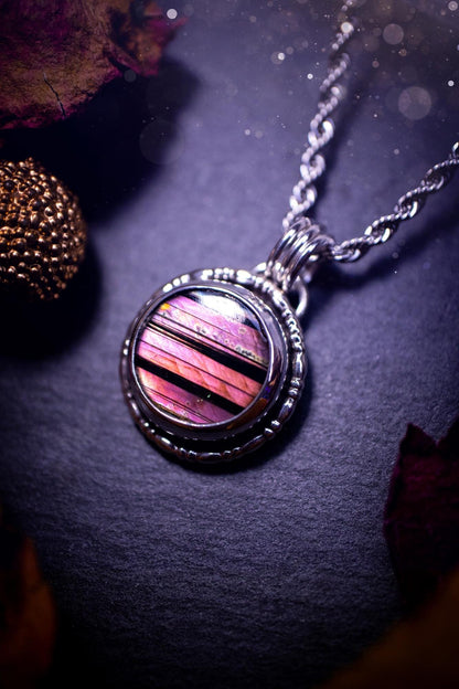 Beautifully handmade, dainty purple, orange, and pink sunset Labradorite spectrolite pendant necklace. This circular labradorite is full of stunning colour and patterns which has been made into a pendant using recycled sterling silver. Crystal gift