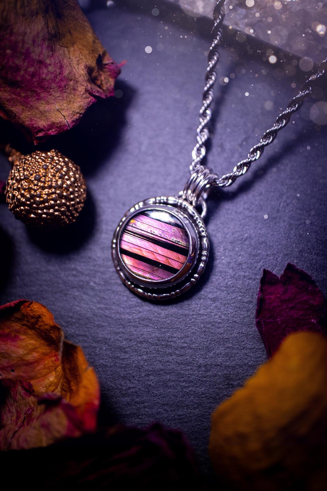 Beautifully handmade, dainty purple, orange, and pink sunset Labradorite spectrolite pendant necklace. This circular labradorite is full of stunning colour and patterns which has been made into a pendant using recycled sterling silver. Crystal gift