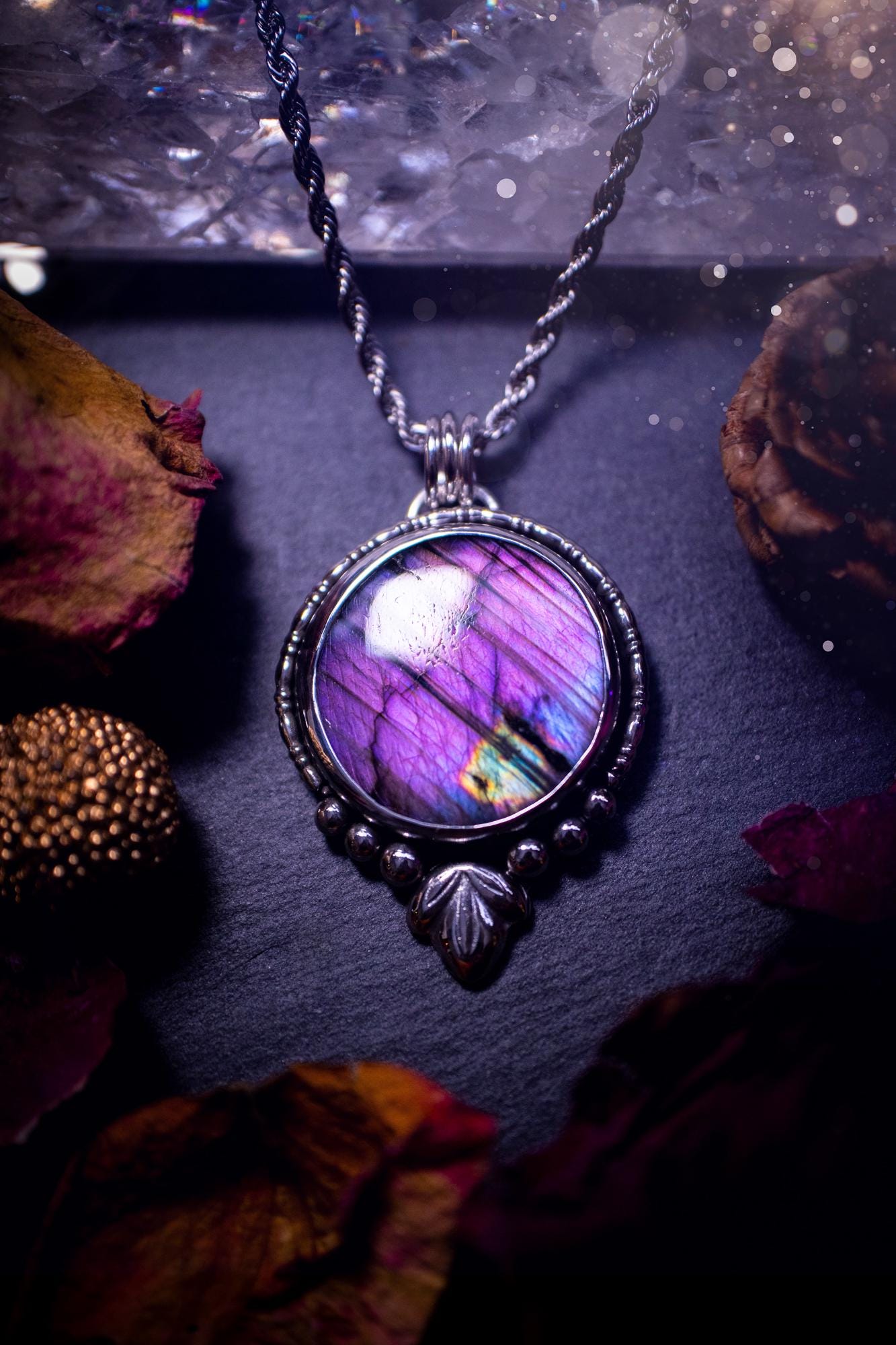 Beautiful and handmade, natural stripey blue and purple labradorite, crystal pendant necklace. This necklace has been made from fine and sterling silver and features silver leaf and ball components. The ideal gift for crystal lovers. Hippy, gothic.