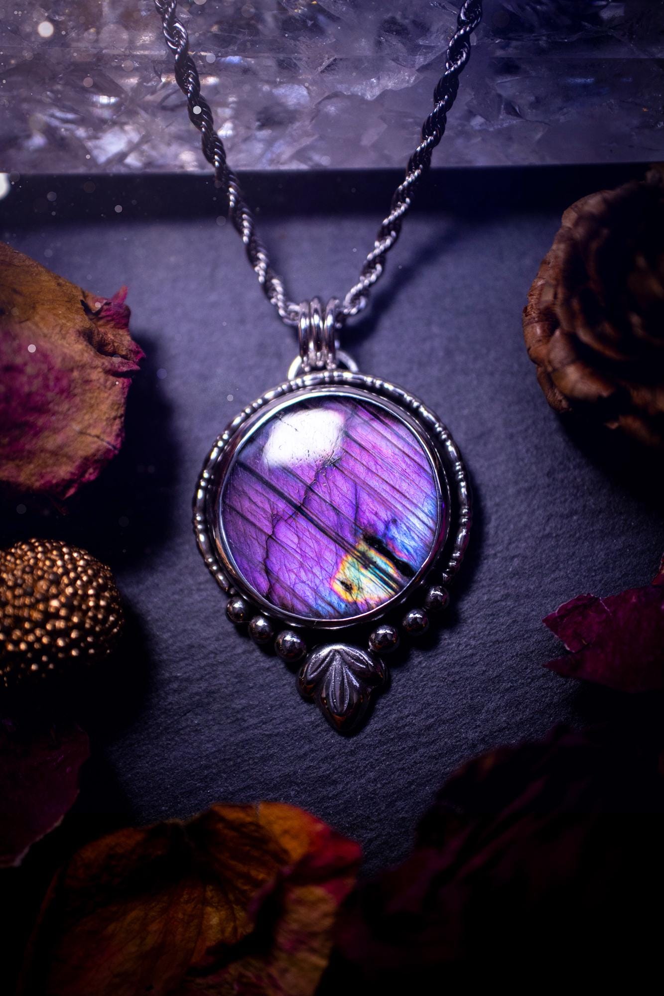 Beautiful and handmade, natural stripey blue and purple labradorite, crystal pendant necklace. This necklace has been made from fine and sterling silver and features silver leaf and ball components. The ideal gift for crystal lovers. Hippy, gothic.