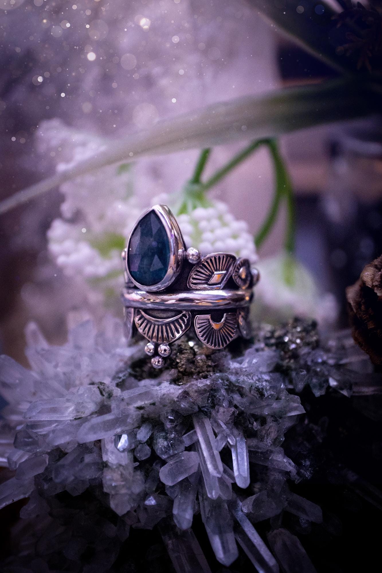 Beautiful and one of a kind, deep blue aqua kyanite crystal, statement ring. Size O 1/2. This stunning and unique ring has been handmade using a high grade kyanite crystal. The kyanite is rose cut giving a gorgeous sparkle, it even has a little shimmering flash. Made from recycled fine and sterling silver and designed with different stamps on a wide band. A very pretty piece to gift to a loved one or to treat yourself. Bohemian, gothic and witchy crystal jewellery.