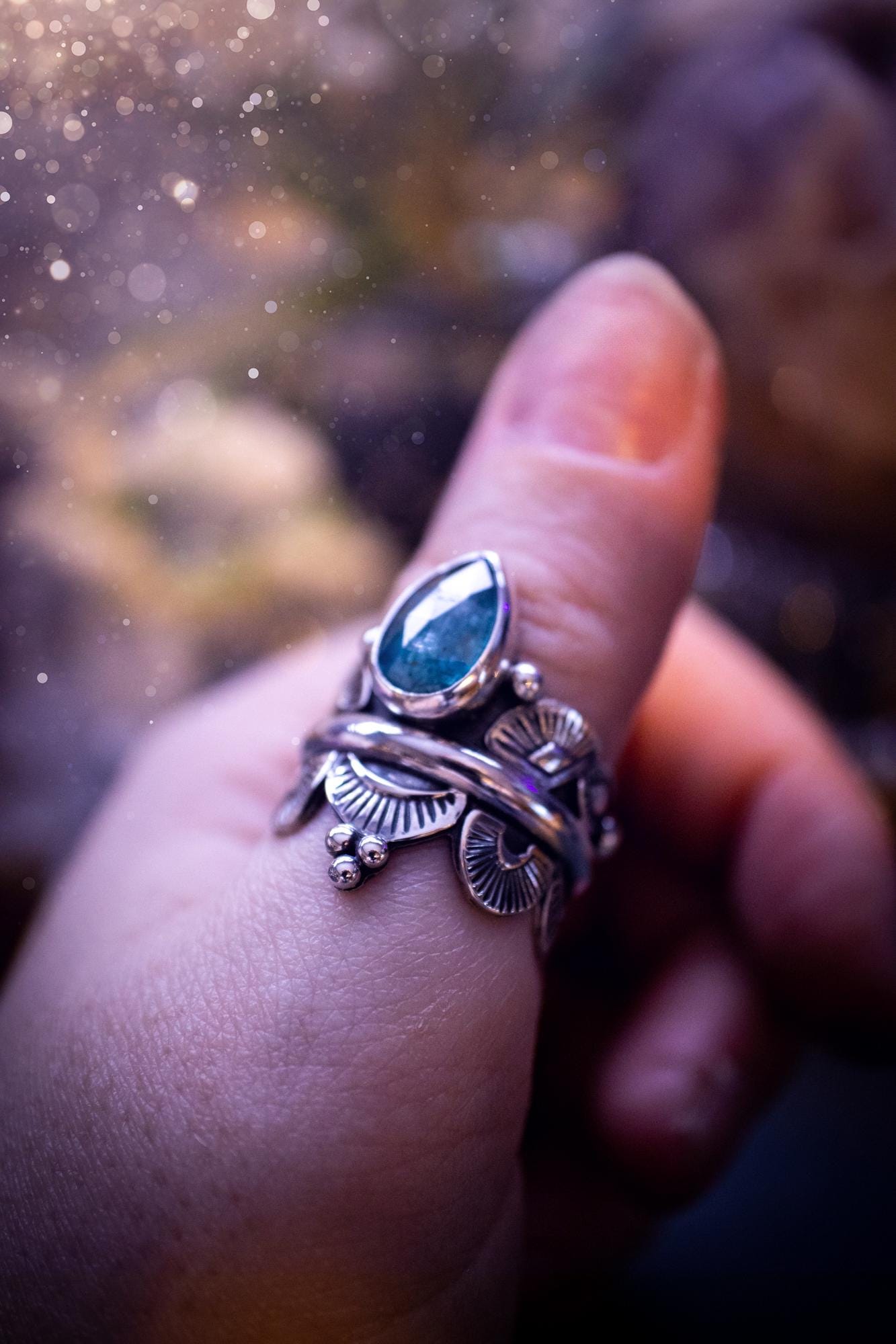Beautiful and one of a kind, deep blue aqua kyanite crystal, statement ring. Size O 1/2. This stunning and unique ring has been handmade using a high grade kyanite crystal. The kyanite is rose cut giving a gorgeous sparkle, it even has a little shimmering flash. Made from recycled fine and sterling silver and designed with different stamps on a wide band. A very pretty piece to gift to a loved one or to treat yourself. Bohemian, gothic and witchy crystal jewellery.