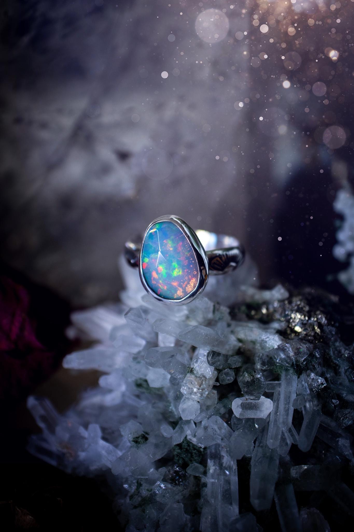 Handmade and beautiful, natural, Ethiopian welo opal, sterling silver stacking ring. This beautiful ring is a size O 1/2 and features the most stunning sparkly opal. Made from recycled fine and sterling silver with a thick stamped ring shank. The ideal gift for any crystal or jewellery lover. Opal is the birthstone for October. Gothic and witchy jewellery