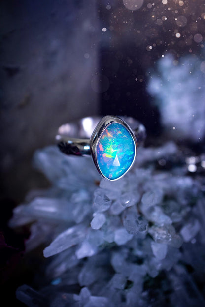 Handmade and beautiful, natural, Ethiopian welo opal, sterling silver stacking ring. This beautiful ring is a size O 1/2 and features the most stunning sparkly opal. Made from recycled fine and sterling silver with a thick stamped ring shank. The ideal gift for any crystal or jewellery lover. Opal is the birthstone for October. Gothic and witchy jewellery, hippy and bohemian.