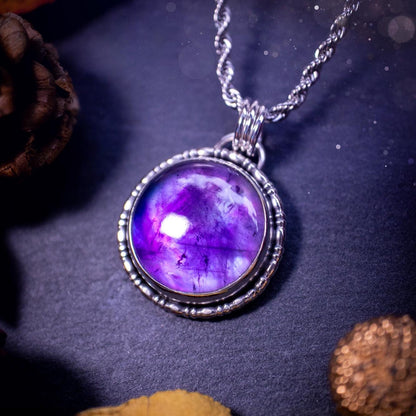 Beautifully handmade, and a one of a kind piece, mother of pearl and amethyst doublet, sterling silver pendant necklace. This pendant features the most beautiful MOP and amethyst doublet that is full of dreamy rainbows with a stunning purple hue. The pendant has been crafted using recycled fine and sterling silver, with a minimalistic design and fancy gallery wire around the circular bezel. This piece is ideal for crystal and jewellery lovers, giving hippy and mermaid vibes.