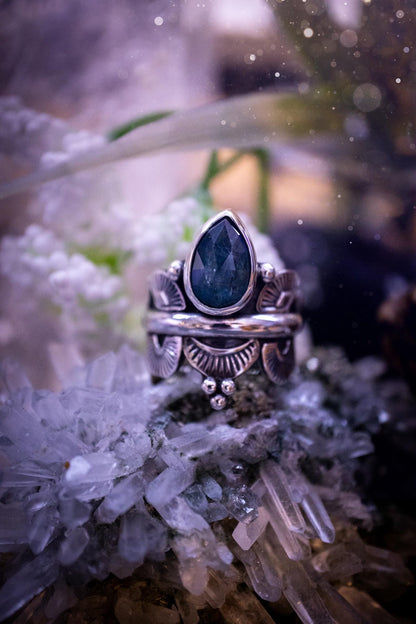 Beautiful and one of a kind, deep blue aqua kyanite crystal, statement ring. Size O 1/2. This stunning and unique ring has been handmade using a high grade kyanite crystal. The kyanite is rose cut giving a gorgeous sparkle, it even has a little shimmering flash. Made from recycled fine and sterling silver and designed with different stamps on a wide band. A very pretty piece to gift to a loved one or to treat yourself. Bohemian, gothic and witchy crystal jewellery.