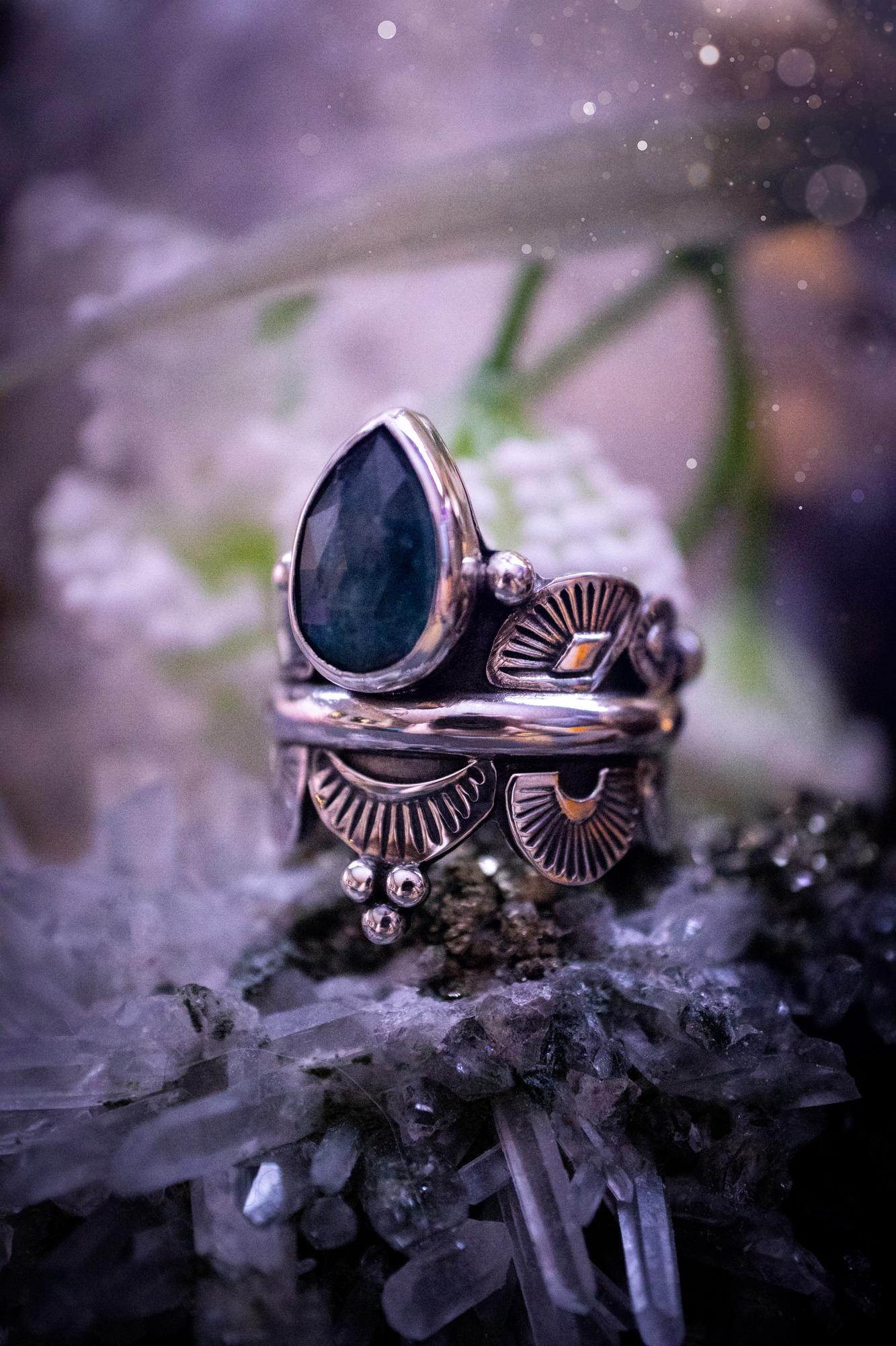 Beautiful and one of a kind, deep blue aqua kyanite crystal, statement ring. Size O 1/2. This stunning and unique ring has been handmade using a high grade kyanite crystal. The kyanite is rose cut giving a gorgeous sparkle, it even has a little shimmering flash. Made from recycled fine and sterling silver and designed with different stamps on a wide band. A very pretty piece to gift to a loved one or to treat yourself. Bohemian, gothic and witchy crystal jewellery.