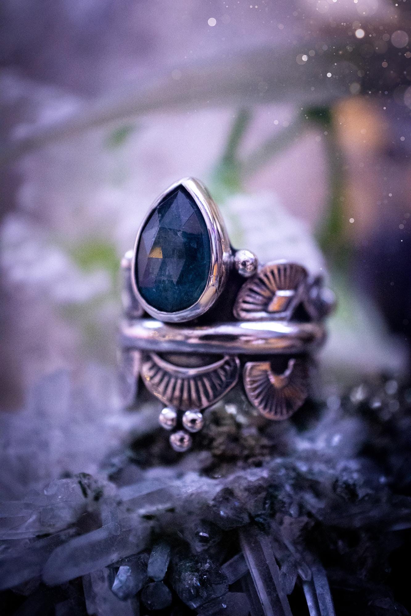 Beautiful and one of a kind, deep blue aqua kyanite crystal, statement ring. Size O 1/2. This stunning and unique ring has been handmade using a high grade kyanite crystal. The kyanite is rose cut giving a gorgeous sparkle, it even has a little shimmering flash. Made from recycled fine and sterling silver and designed with different stamps on a wide band. A very pretty piece to gift to a loved one or to treat yourself. Bohemian, gothic and witchy crystal jewellery.