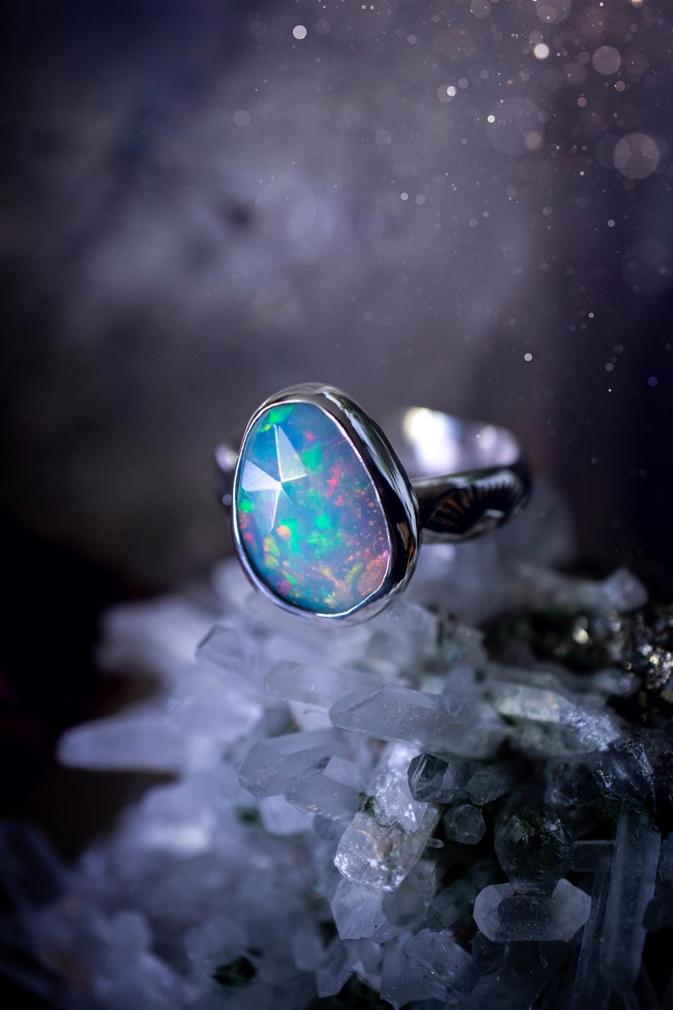 Handmade and beautiful, natural, Ethiopian welo opal, sterling silver stacking ring. This beautiful ring is a size O 1/2 and features the most stunning sparkly opal. Made from recycled fine and sterling silver with a thick stamped ring shank. The ideal gift for any crystal or jewellery lover. Opal is the birthstone for October. Gothic and witchy jewellery