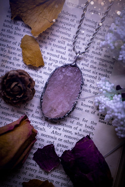 Natures finest, beautiful and raw, rose quartz, soft soldered crystal pendant necklace. This piece of jewellery is carefully handmade using the soft solder method, also known as the tiffany technique. Featuring the most natural and stunning, raw, rose quartz crystal full of pink hues. A very unique piece of jewellery. This pendant necklace would be ideal for any special occasion and for gifting to a loved one. Witchy and gothic jewellery created for the soul.