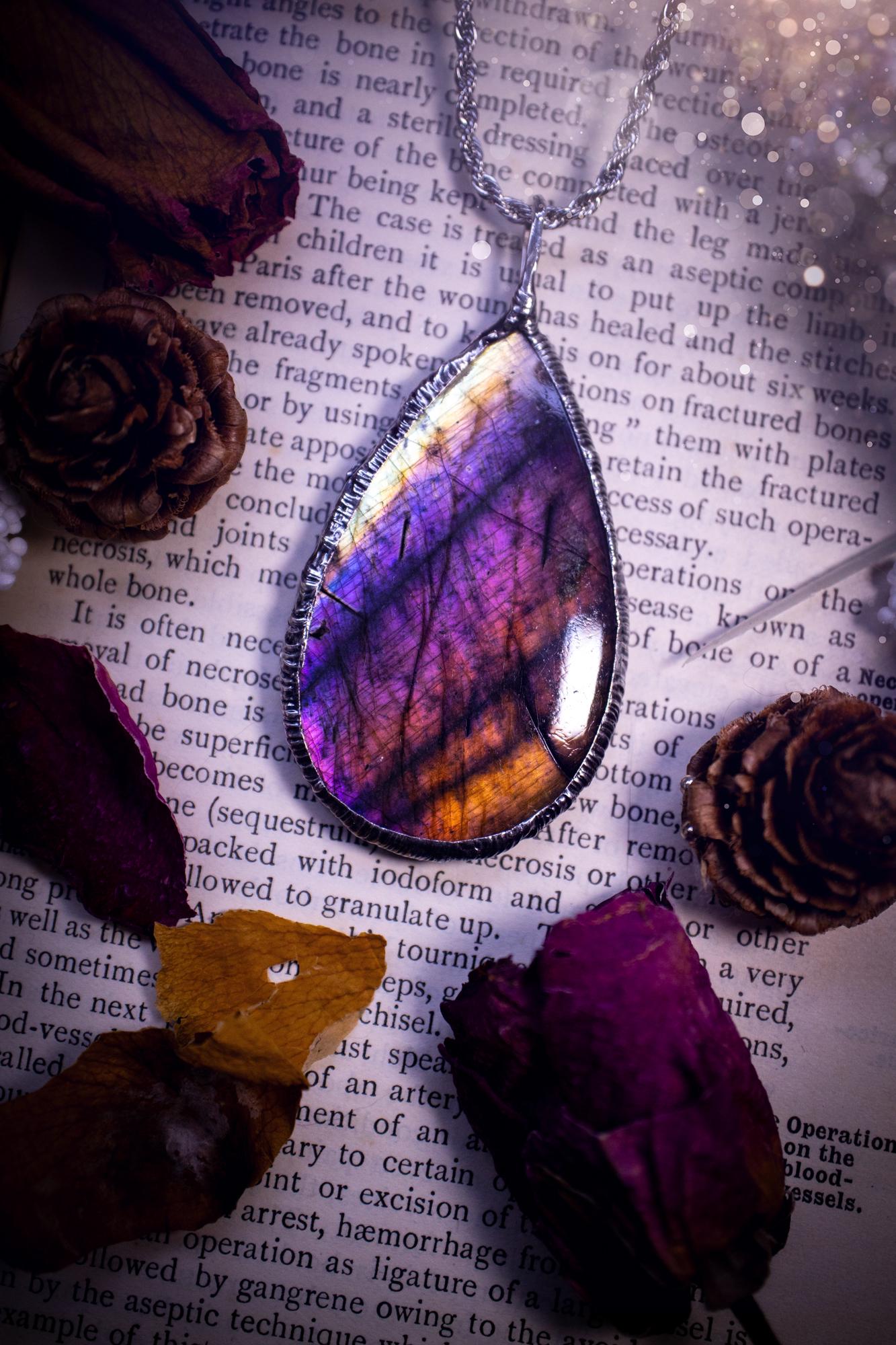 The ultimate labradorite soft soldered pendant necklace. This pendant necklace features the most beautiful and natural Labradorite spectrolite crystal that has so many hues of silver, purple, pink and orange. Handmade using the tiffany technique, also known as soft soldering. This piece is made from solder which contains metals and silver and is safe to wear. The ideal gift for any jewellery lover and crystal collector! Witchy, gothic and hippy jewellery that has been made for the soul.