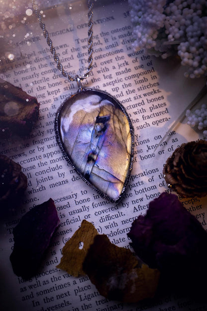 The ultimate labradorite soft soldered pendant necklace. This pendant necklace features the most beautiful, natural and very unique Labradorite spectrolite crystal that has so many hues of silver, purple, pink and orange. Handmade using the tiffany technique, also known as soft soldering. This piece is made from solder which contains silver and is safe to wear. The ideal gift for any jewellery lover and crystal collector! Witchy, gothic and hippy jewellery that has been made for the soul.