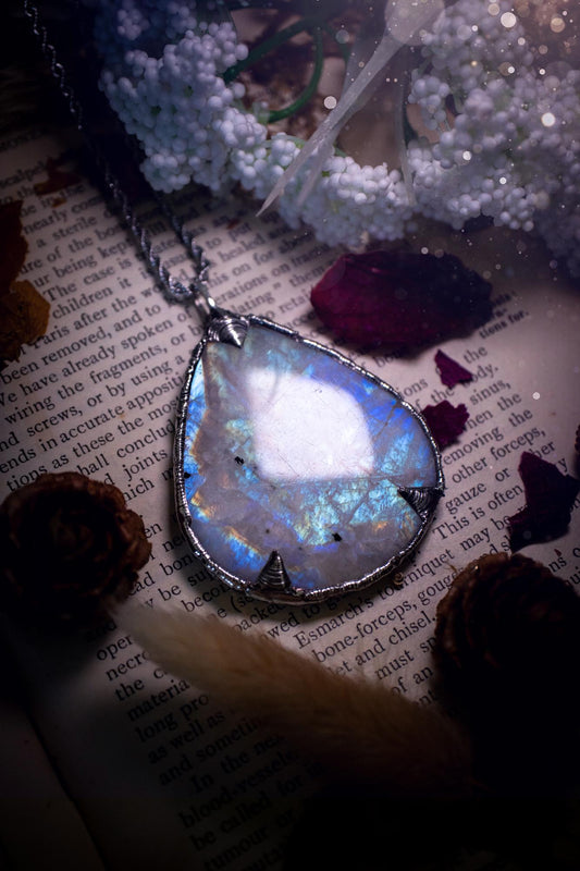 Handmade and beautiful, rainbow moonstone, soft soldered pendant necklace. This pendant necklace features the most gorgeous and flashy rainbow moonstone crystal, full of glittery shimmer and a deep lovely blue hue. Handcrafted using the soft solder method, also known as the tiffany technique, an ancient technique used to created stained glass windows. The solder used is lead free and totally safe to wear, it contains elements of silver and polishes up to a high lustre. Gothic jewellery