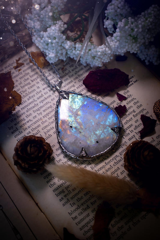 Handmade and beautiful, rainbow moonstone, soft soldered pendant necklace. This pendant necklace features the most gorgeous and flashy rainbow moonstone crystal, full of glittery shimmer and a deep lovely blue hue. Handcrafted using the soft solder method, also known as the tiffany technique, an ancient technique used to created stained glass windows. The solder used is lead free and totally safe to wear, it contains elements of silver and polishes up to a high lustre. Gothic jewellery