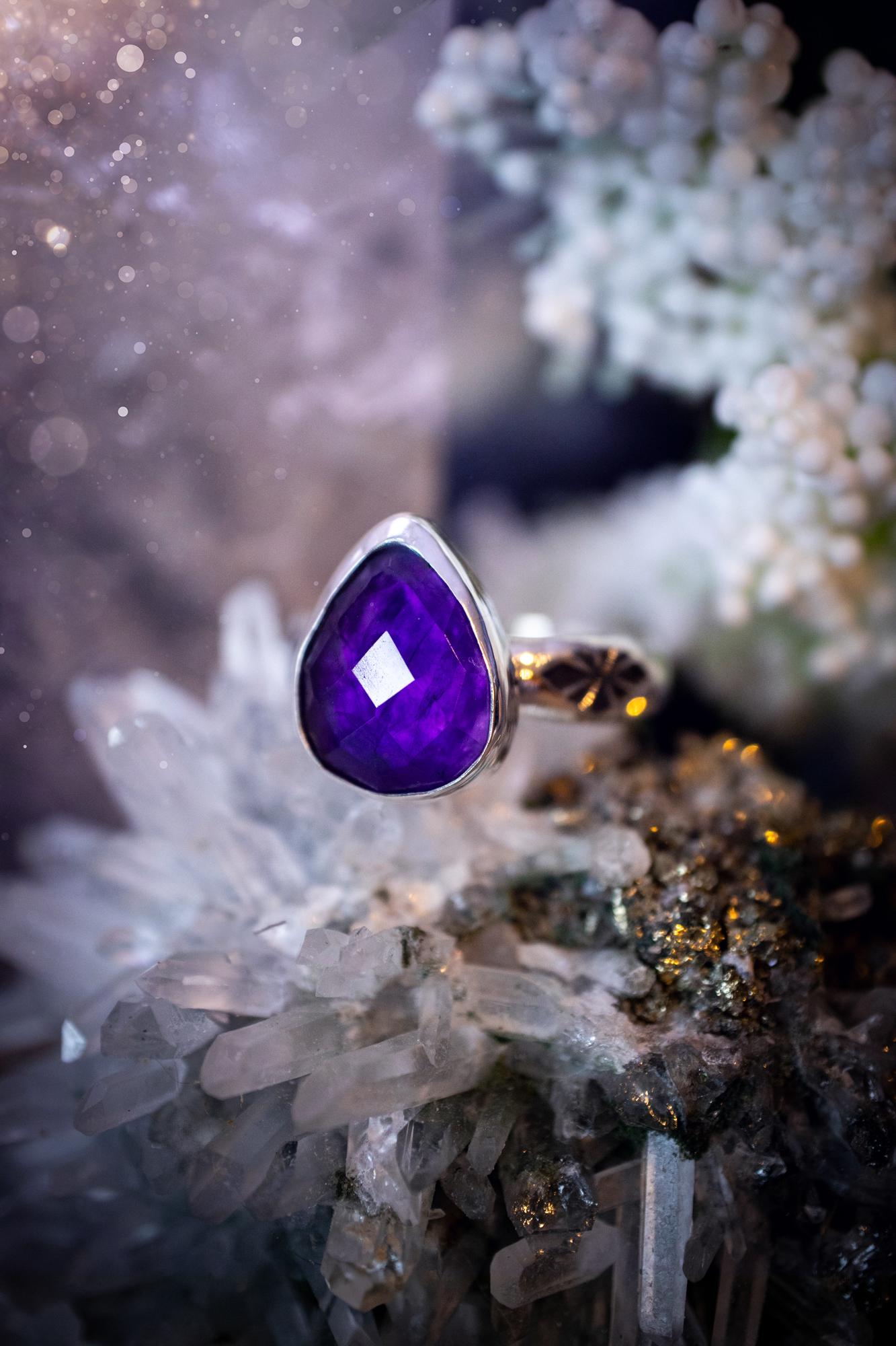 Beautiful and handcrafted, natural purple amethyst crystal, staking ring. This stunning ring has been hand made using fine and sterling silver. It features a beautiful and natural purple amethyst crystal that is rose cut with such a gorgeous colour. The ring shank on this ring has been stamped with a gothic pattern to give it a one of a kind vibe. Ideal gift for that special person in your life, or for any crystal and jewellery lover. Hippy, witchy and gothic jewellery for the soul.