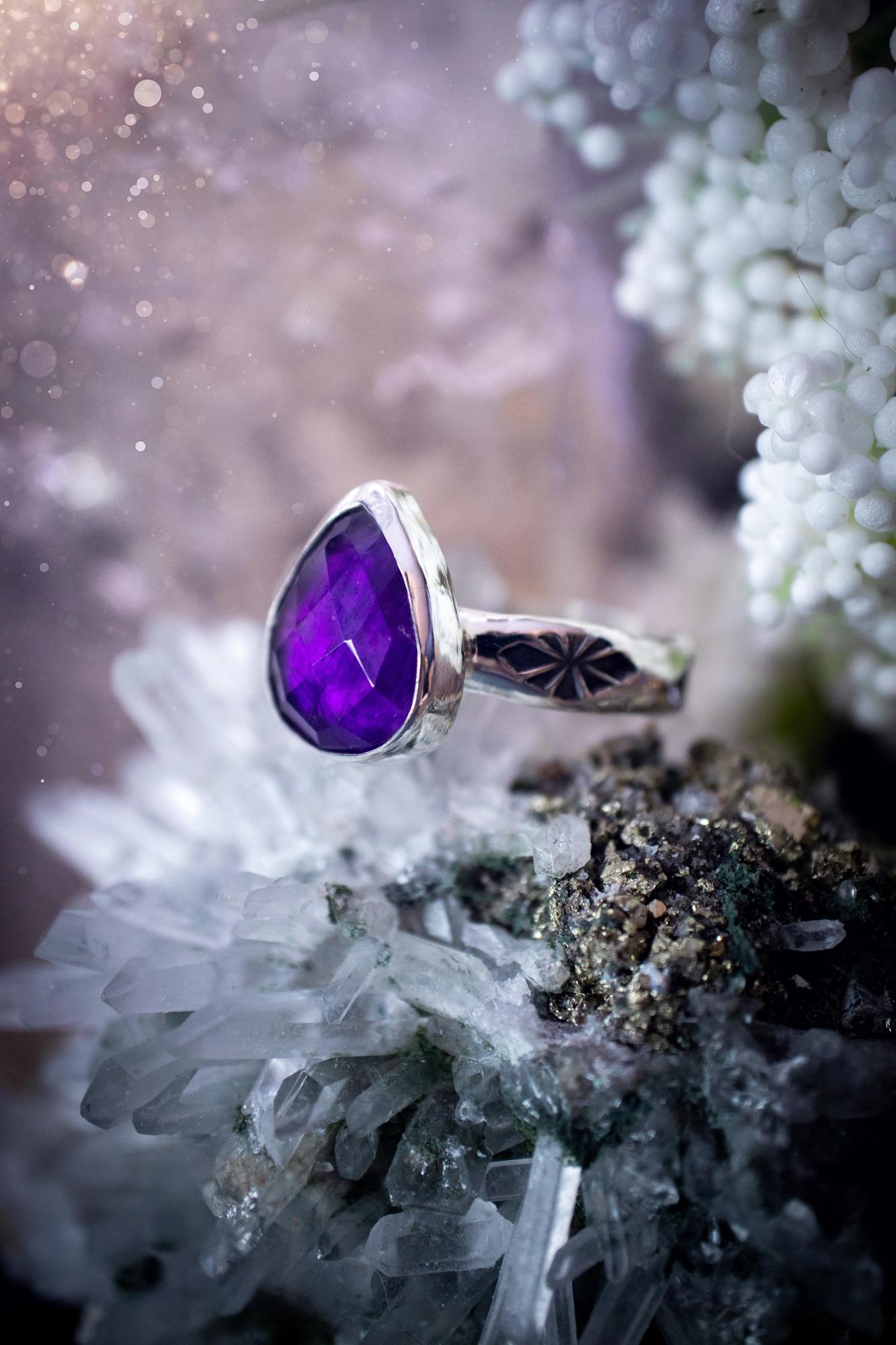 Beautiful and handcrafted, natural purple amethyst crystal, staking ring. This stunning ring has been hand made using fine and sterling silver. It features a beautiful and natural purple amethyst crystal that is rose cut with such a gorgeous colour. The ring shank on this ring has been stamped with a gothic pattern to give it a one of a kind vibe. Ideal gift for that special person in your life, or for any crystal and jewellery lover. Hippy, witchy and gothic jewellery for the soul.