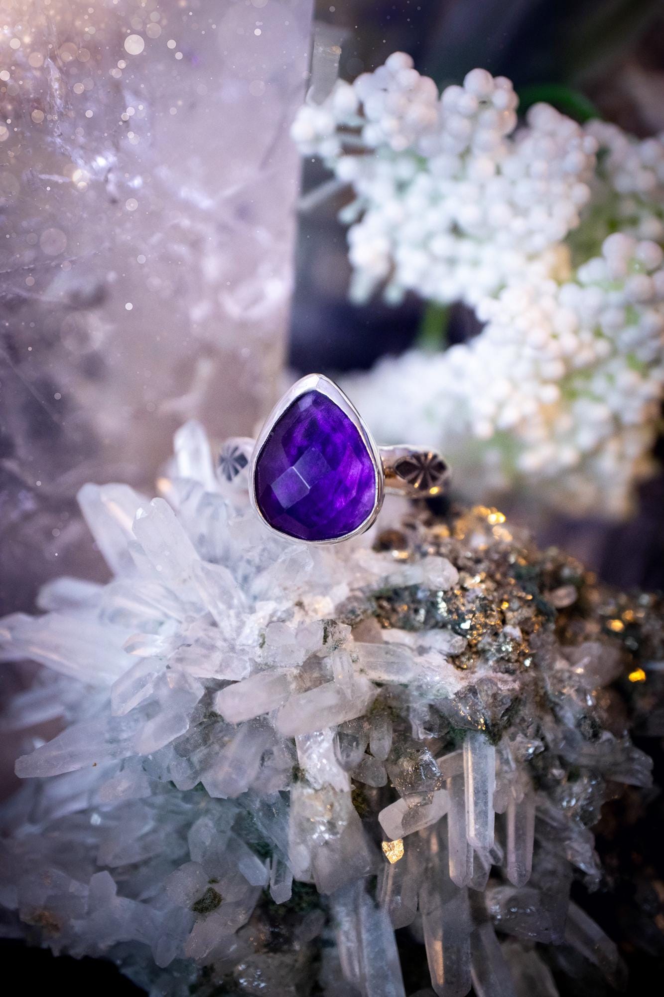 Beautiful and handcrafted, natural purple amethyst crystal, staking ring. This stunning ring has been hand made using fine and sterling silver. It features a beautiful and natural purple amethyst crystal that is rose cut with such a gorgeous colour. The ring shank on this ring has been stamped with a gothic pattern to give it a one of a kind vibe. Ideal gift for that special person in your life, or for any crystal and jewellery lover. Hippy, witchy and gothic jewellery for the soul.