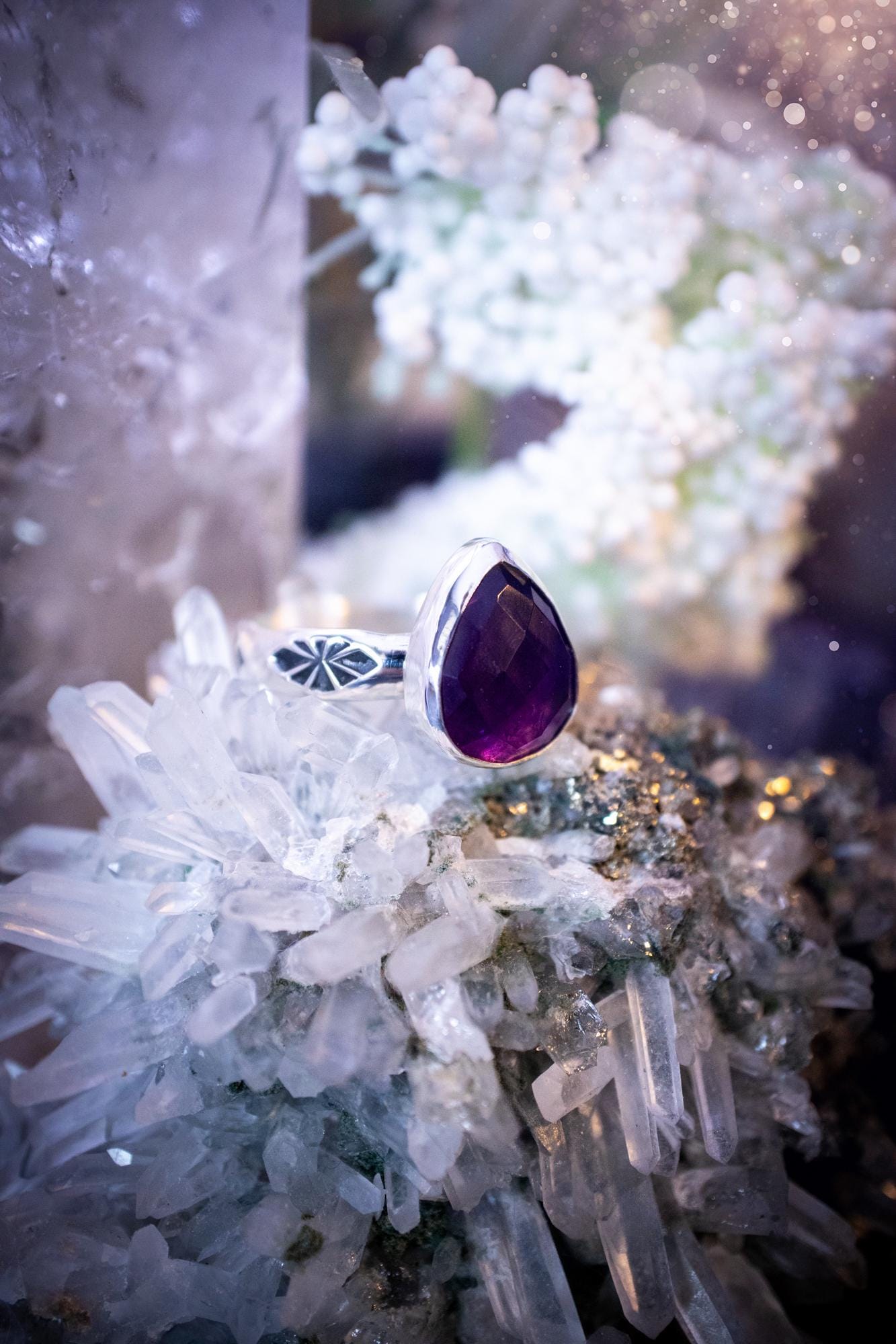 Beautiful and handcrafted, natural purple amethyst crystal, staking ring. This stunning ring has been hand made using fine and sterling silver. It features a beautiful and natural purple amethyst crystal that is rose cut with such a gorgeous colour. The ring shank on this ring has been stamped with a gothic pattern to give it a one of a kind vibe. Ideal gift for that special person in your life, or for any crystal and jewellery lover. Hippy, witchy and gothic jewellery for the soul.