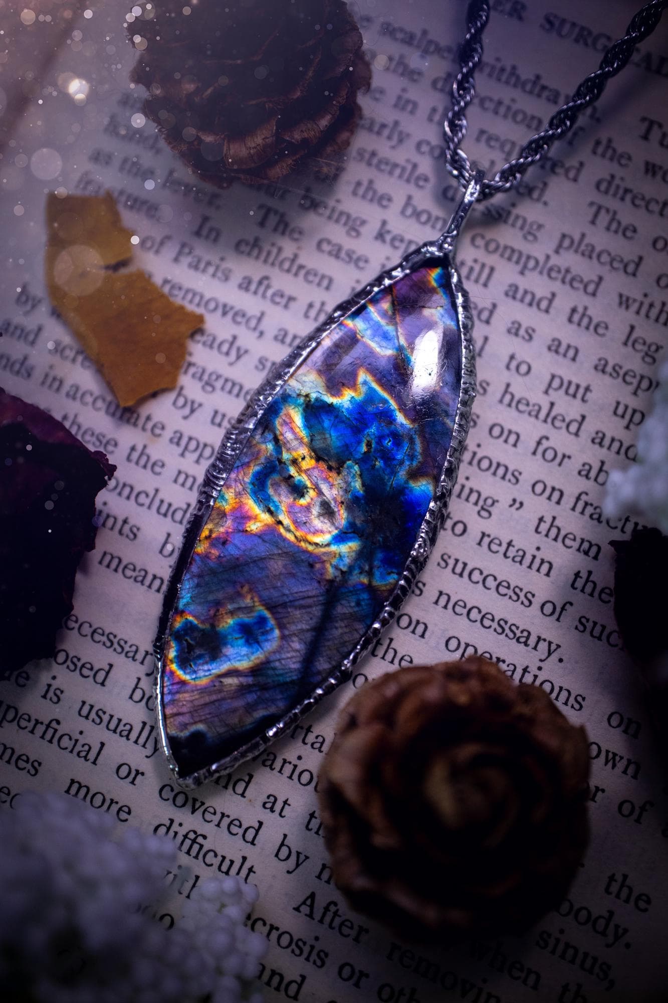The ultimate labradorite spectrolite, soft soldered pendant necklace. This pendant necklace features the most beautiful and natural Labradorite spectrolite crystal that has so many hues of purple, blues and silvers. Handmade using the tiffany technique, also known as soft soldering. This piece is made from solder which contains metals and silver and is safe to wear. The ideal gift for any jewellery lover and crystal collector! Witchy, gothic and hippy jewellery that has been made for the soul.