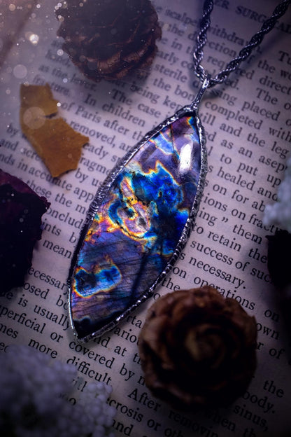 The ultimate labradorite spectrolite, soft soldered pendant necklace. This pendant necklace features the most beautiful and natural Labradorite spectrolite crystal that has so many hues of purple, blues and silvers. Handmade using the tiffany technique, also known as soft soldering. This piece is made from solder which contains metals and silver and is safe to wear. The ideal gift for any jewellery lover and crystal collector! Witchy, gothic and hippy jewellery that has been made for the soul.