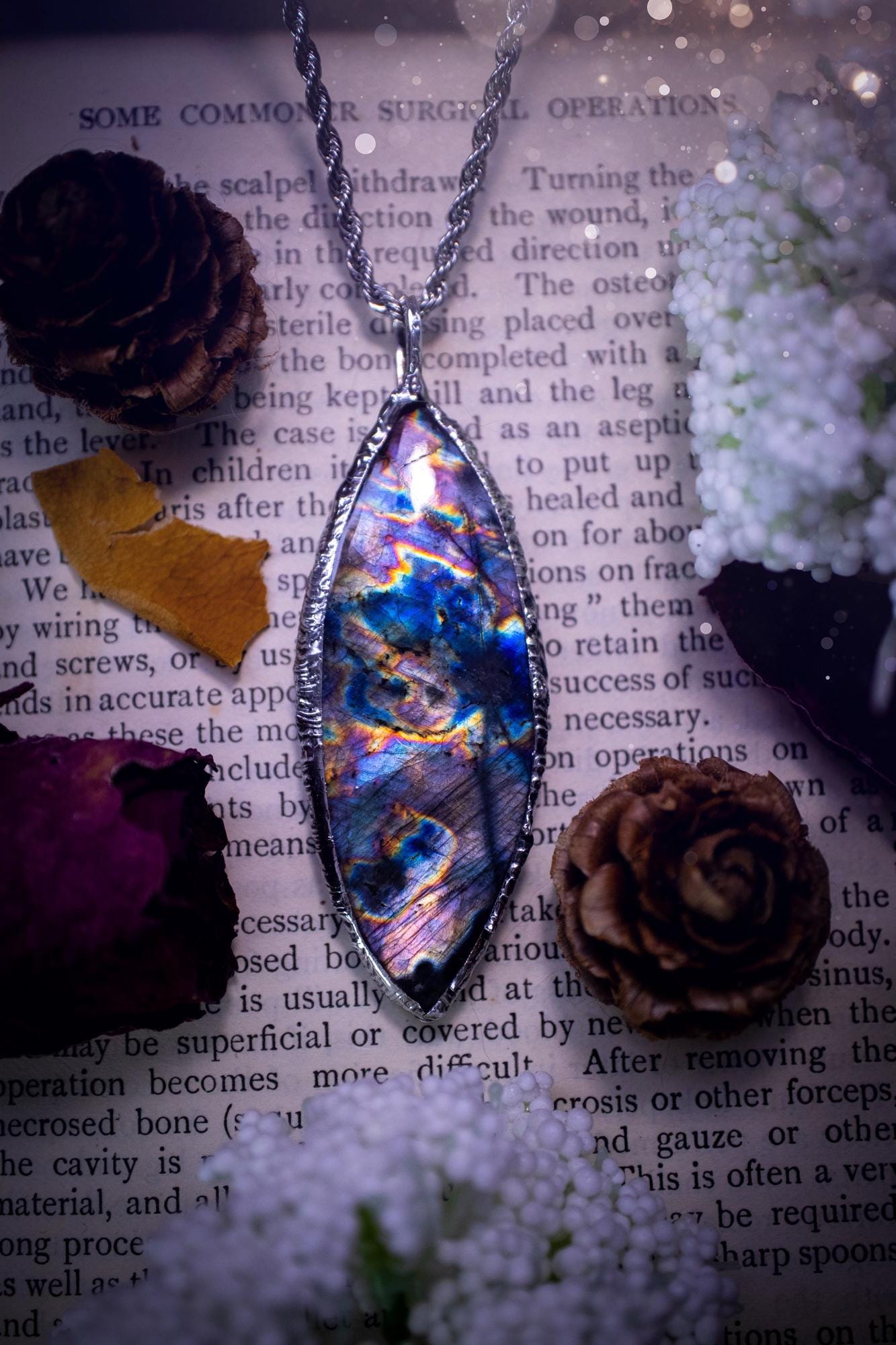 The ultimate labradorite spectrolite, soft soldered pendant necklace. This pendant necklace features the most beautiful and natural Labradorite spectrolite crystal that has so many hues of purple, blues and silvers. Handmade using the tiffany technique, also known as soft soldering. This piece is made from solder which contains metals and silver and is safe to wear. The ideal gift for any jewellery lover and crystal collector! Witchy, gothic and hippy jewellery that has been made for the soul.
