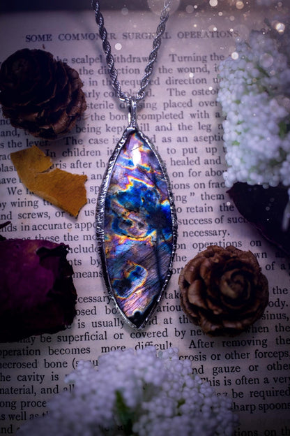 The ultimate labradorite spectrolite, soft soldered pendant necklace. This pendant necklace features the most beautiful and natural Labradorite spectrolite crystal that has so many hues of purple, blues and silvers. Handmade using the tiffany technique, also known as soft soldering. This piece is made from solder which contains metals and silver and is safe to wear. The ideal gift for any jewellery lover and crystal collector! Witchy, gothic and hippy jewellery that has been made for the soul.