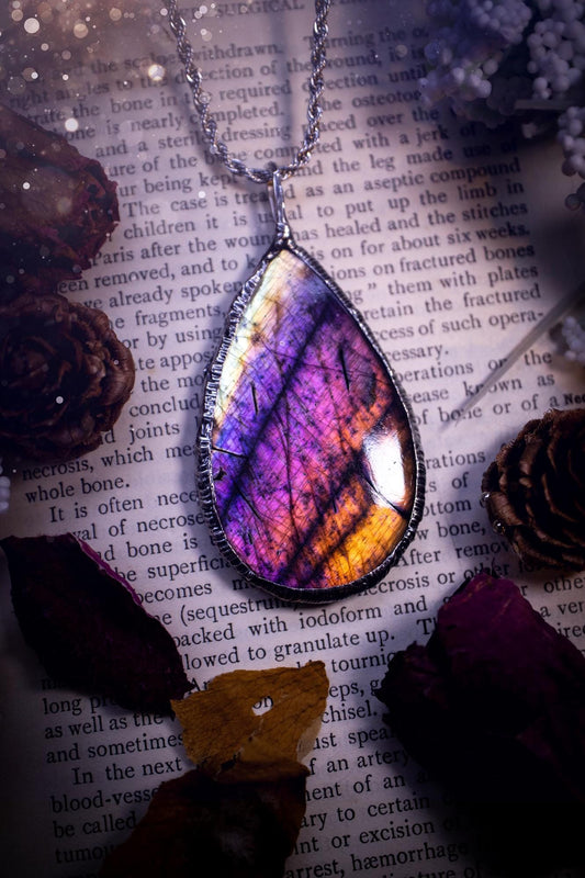 The ultimate labradorite soft soldered pendant necklace. This pendant necklace features the most beautiful and natural Labradorite spectrolite crystal that has so many hues of silver, purple, pink and orange. Handmade using the tiffany technique, also known as soft soldering. This piece is made from solder which contains metals and silver and is safe to wear. The ideal gift for any jewellery lover and crystal collector! Witchy, gothic and hippy jewellery that has been made for the soul.