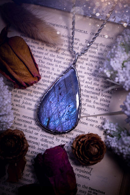 The ultimate labradorite soft soldered pendant necklace. This pendant necklace features the most beautiful and natural Labradorite spectrolite crystal that has so many hues of pastel blue and purples. Handmade using the tiffany technique, also known as soft soldering. This piece is made from solder which contains metals and silver and is safe to wear. The ideal gift for any jewellery lover and crystal collector! Witchy, gothic and hippy jewellery that has been made for the soul.